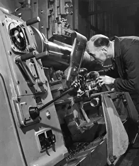 Industrial Manufacturing Process Imprime: A lathe operator at work