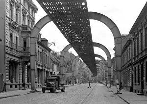 Cobblestone Road Imprime: Road with overhead structure