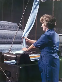 Textile Manufacturing Process Imprime: Threads entering a weaving machine