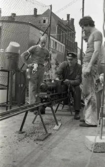 Railway Transport Imprime: Train driver prepares engine on model steam train