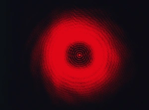Impresiones de La patrón de difracción creado al proyectar luz monocromática en un objeto circular. Las ondas de luz se curvan y dispersan a su alrededor del objeto y convergen Imágenes de junio de 2005: Diffraction