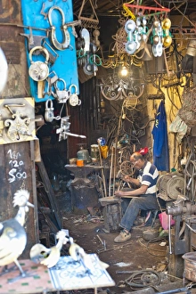 Marrakech Souk Imprime: Carpenter and metalworker in his workshop in the souk