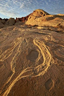 Erosion Patterns In Rocks Imprime: Erosion pattern in yellow sandstone under patterned clouds
