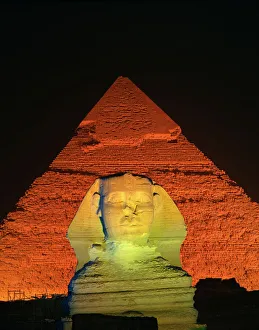Egyptian Archaeological Sites Imprime: The Sphinx and one of the pyramids illuminated at night, Giza, UNESCO World Heritage Site