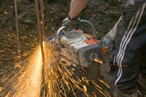 Construction Worker Equipment Imprime: a builder using an angle grinder