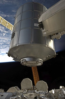 International Space Station Imprime: The Permanent Multipurpose Module in the grasp of Canadarm2
