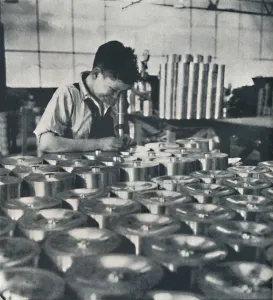 Air Transport Industry Imprime: Apprentice with microscope (testing the hardness of pistons), 1941. Artist: Cecil Beaton