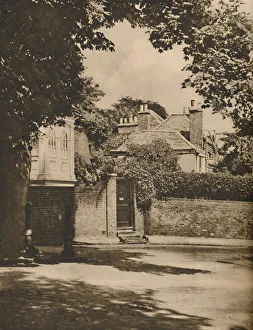 London Landscape Photography Imprime: Sunlight and Shadow in a Winding Highgate Road, c1935. Creator: Paterson