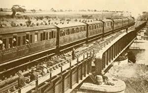 Black And White Train Images Imprime: A Train Passing Over The Bridge, c1930. Creator: Unknown