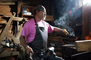 Blacksmith At Work Imprime: Blacksmith working in his forge