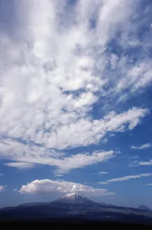 Tranquil Nature Scenes Imprime: Clouds over a snowcapped mountain