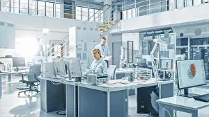 Computer Specialist Imprime: Engineer working on a computer