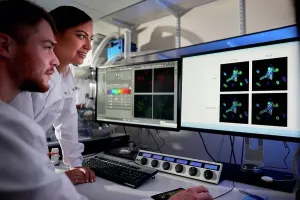 Computer Science Research Imprime: Scientists in laboratory using computer