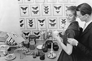 Young Adults In Love Imprime: In the 1950s. A young with the typical 1950s designed objects