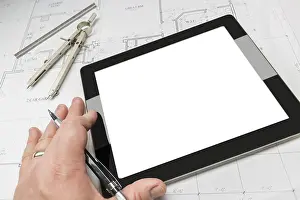 Residential Architecture Imprime: Architech working on blank computer tablet