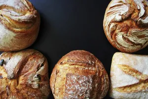 Bread Assortment Imprime: Bread. Assortment of different types of bread on a blackn background