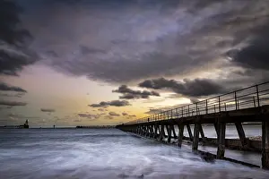 Dramatic Clouds At Sunset Imprime: Bridge in the sea with dramatic clouds at sunset