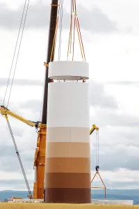Environmental Protection Symbol Imprime: Building and assembling a construction windmill by crane