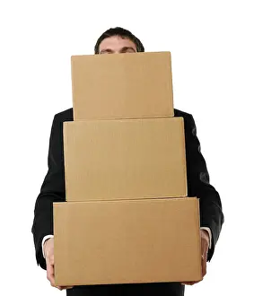 Caucasian Male In Studio Shot Imprime: Businessman overloaded with a stack of boxes