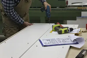 Woodworking Equipment Imprime: Carpenter at work in his carpentry workshop