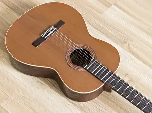Plucked String Instrument Imprime: A classical guitar with six nylon strings