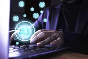 Digital Technology Imprime: Close up of a man using a computer with artificial intelligence icons