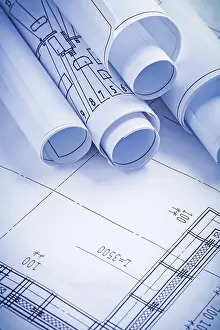 Rolled Up Documents Imprime: Close up view stack of white construction blueprints