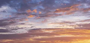 Evening Sun Photography Imprime: Clouds in the evening light at sunset