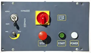 Passenger Transport System Imprime: Complex machine control panel with red buttons and signs