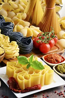 Empty Kitchen Table Setting Imprime: Composition with different sorts of pasta on kitchen table
