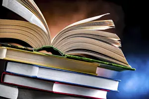 Educational Institution Imprime: A composition with an open book lying on a stack of other books