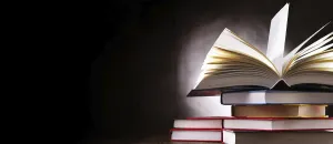 Deserted Library Scene Imprime: A composition with an open book lying on a stack of other books