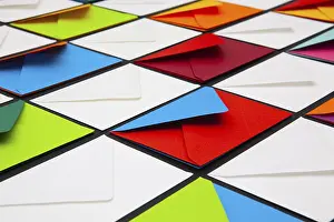 White Envelopes Imprime: Composition with white and colored envelopes on the table