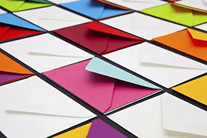 White Envelopes Imprime: Composition with white and colored envelopes on the table