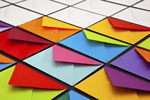 Multicolored Writing Utensils Imprime: Composition with white and colored envelopes on the table
