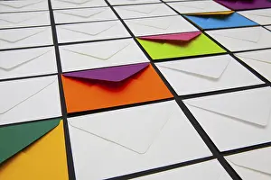 White Envelopes Imprime: Composition with white and colored envelopes on the table