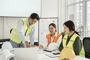 Single Person Office Work Imprime: Three construction professionals