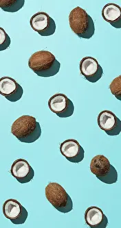 Urban Environment Image Imprime: Creative layout of coconuts half on blue background