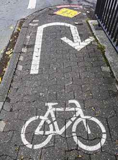 Cycle Path Marking Imprime: Cycle path marking on a pavement