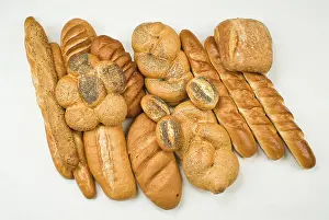 Flour Based Baked Goods Imprime: Different kinds of bread on a studio background