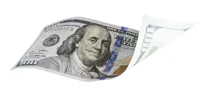 US Dollar Banknote Imprime: One hundred dollar bill falling or floating on empty background