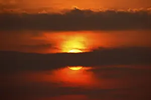 Dramatic European Landscape Imprime: Dramatic sunset behind clouds, Schleswig-Holstein