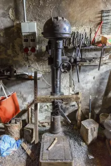 Traditional Craftsman Imprime: Drilling machine in an old workshop