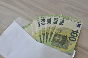 Office Supplies Stationery Imprime: Many one hundred euro notes in an envelope on a table