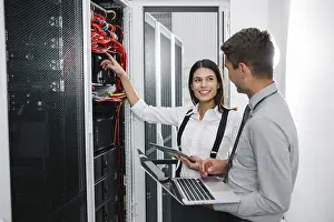 Blockchain Technology Imprime: IT expert checking supercomputer server