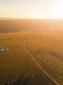 Agricultural Fields Germany Imprime: Extensive fields in the light of the sunset