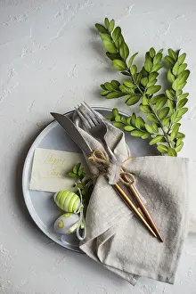 Plain White Background Photo Imprime: Festive table setting for Easter dinner on white background with copy space