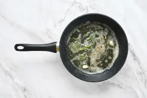 Savory Meal Preparation Imprime: A frying pan is on a marble surface