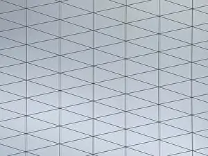 Contemporary Decorative Item Imprime: A gray surface featuring a modern geometric pattern composed of interconnected triangles