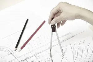 Engineering Blueprint Imprime: Hand of engineer working on a construction plan